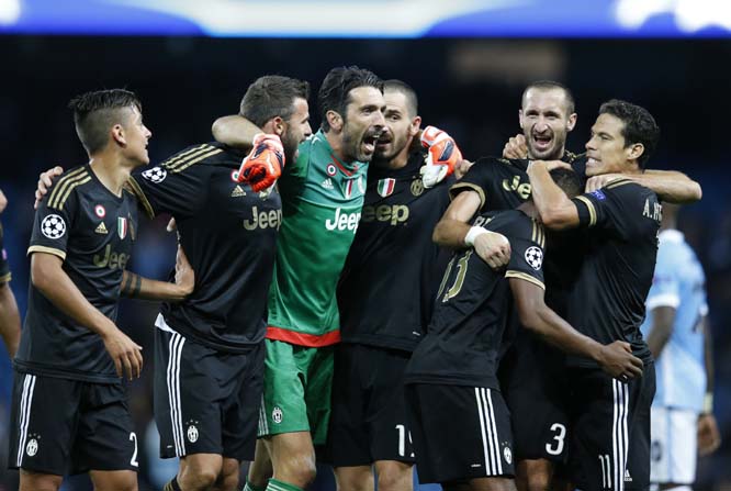 Juventus' players celebrate after the Champions League group D soccer match between Manchester City and Juventus at the Etihad Stadium, Manchester, England on Tuesday. Juventus won the match 2-1.