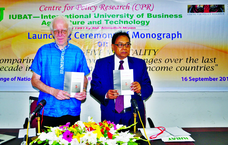 Dr John Richards, writer of a book titled 'Comparative study of death rate of children in South Asia and low-income countries' along with other distinguished guest holds the copies of book at its cover unwrapping ceremony held at the Jatiya Press Club o