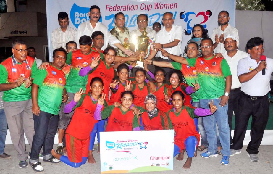 Members of Institute of Kabaddi Jatrabari, the champions of the Aarong Dairy Federation Cup Women Kabaddi Tournament with the guests and the officials of Bangladesh Kabaddi Federation pose for a photo session at the Kabaddi Stadium on Thursday.