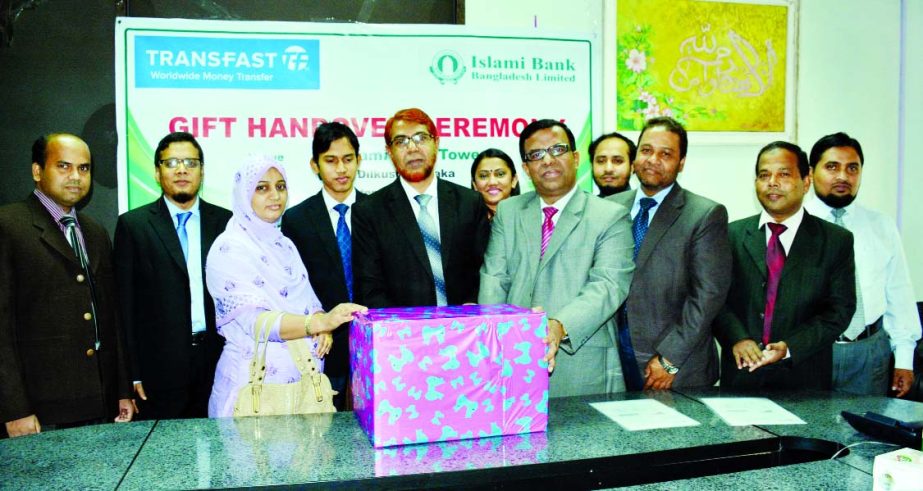 Abdus Sadeque Bhuiyan, Deputy Managing Director of Islami Bank Bangladesh Ltd and Khairuzzaman, Country Head of Transfast LLC, USA handing over the prize to the winners of the special remittance EID campaign recently. Top executives and officials of the b