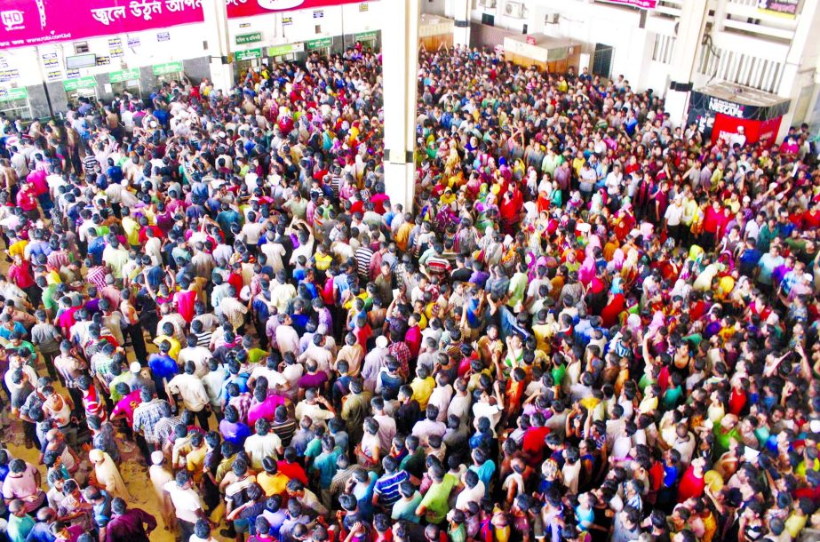 Thousands of people thronged the counters at Kamalapur Railway Station on Friday to buy advance tickets facing untold sufferings to go on Eid holiday