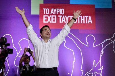 Syriza leader Alexis Tsipras greets his supporters during the party's main pre-election rally in central Athens on Friday.