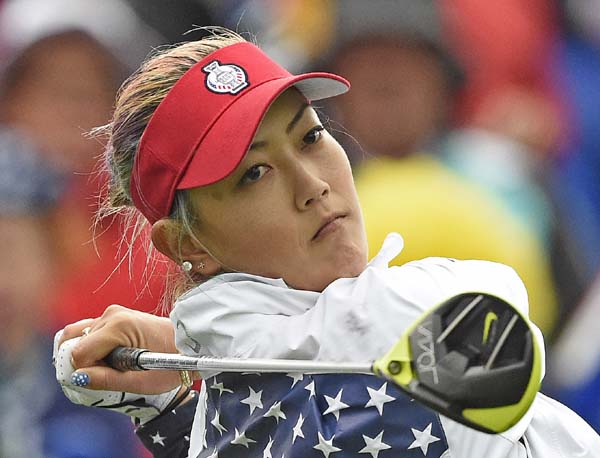 Michelle Wie of United States tees off in the foursomes at the Solheim Cup golf tournament in St. Leon-Rot, southern Germany on Saturday.