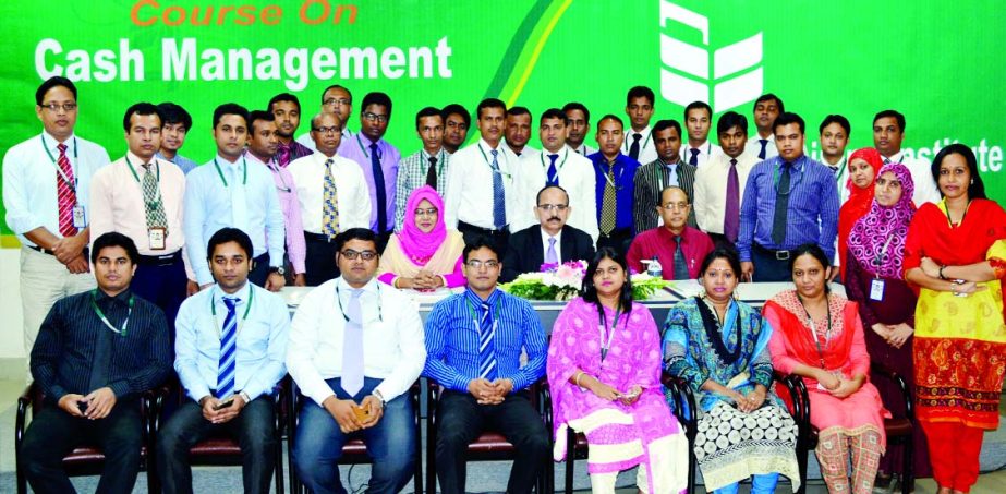 Md Badiul Alam, Managing Director (CC) of National Bank Limited poses with the participants of a ' training course on 'Cash Management' at its training institute recently. Hari Narayan Das and Farzana Haque Sr Faculties of the institute were present.