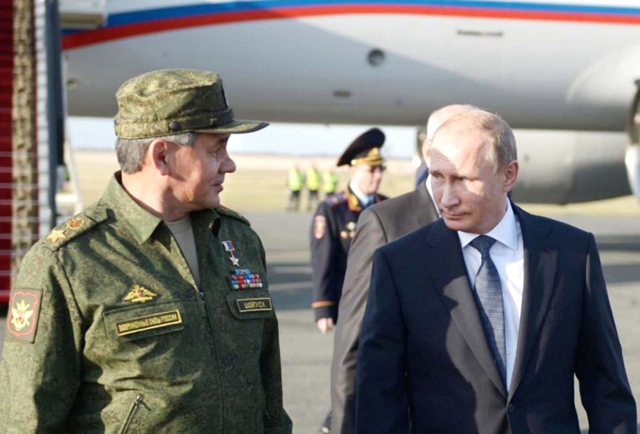 Russian President Vladimir Putin speaks with Defence Minister Sergei Shoigu on his arrival in Orenburg region, about 1300 kilometres (800 miles) southeast of Moscow, Russia on Saturday.