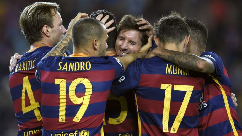 Lionel Messi celebrates with teammates after scoring from the penalty spot in Barcelona's 4-1 win over Levante on Sunday.