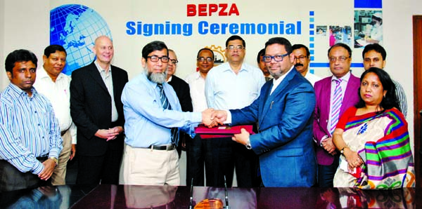 Sayed Nurul Islam, Member (Investment Promotion) of BEPZA and Muhammad Shahed Mahmud, Managing Director of progress Apparels (Bangladesh) Ltd ink a deal to set up a readymade garments industry in Iswhardi Export Processing Zone at BEPZA Complex in the cit