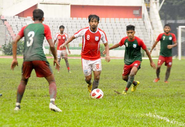 A scene from the practice football match between Bangladesh National Football team and Bangladesh Under-19 National Football team at the Bangabandhu National Stadium on Wednesday. Bangladesh National Football team won the match 1-0.