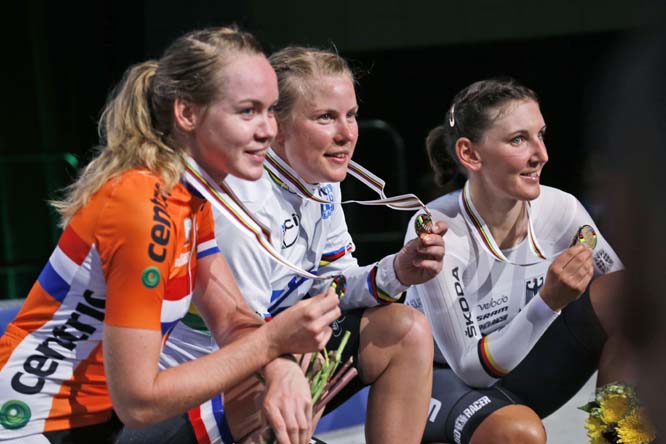 Linda Melanie Villumsen (center) of New Zealand, winner of the women's elite time trials, along second-place finisher Anna Van Der Breggen (left) of the Netherlands and third-place finisher Lisa Brennauer (right) of Germany, pose with their medals at the