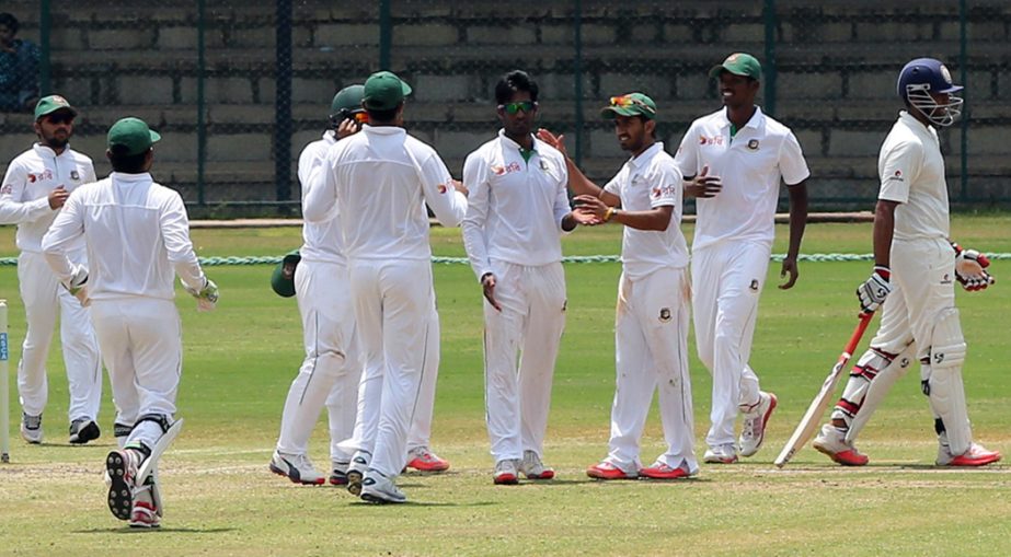 Players of Bangladesh A team celebrate after dismissal of a Karnataka wicket on the second day of the three-dayer match between Bangladesh A team and Karnataka at Mysore in India on Wednesday.