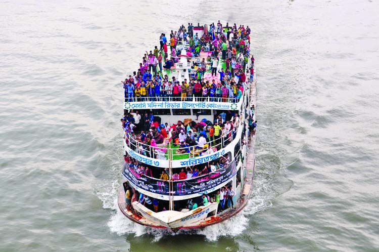 A launch packed beyond capacity sail through the river Buriganga two days ahead of holy Eid-ul- Azha putting its home-bound passengers at risk, proving once again that monitoring did not work to check overloading. The snap was taken from Postogola Bridge