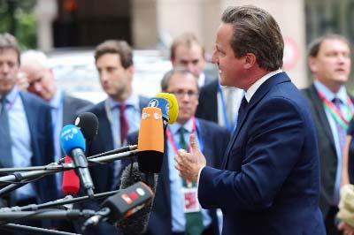 Britain's PM David Cameron addressing a news conference in Brussels.