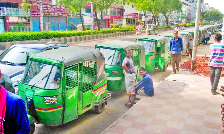 Hundreds of CNG auto-rickshaws at long queue for collecting gas at CNG station in the capital on Sunday.