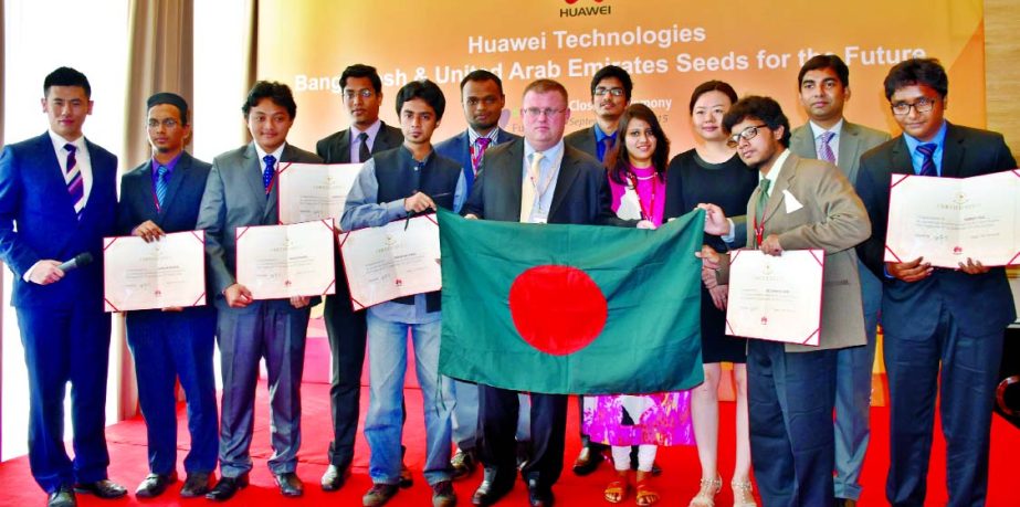 Huawei Seeds for the Future winners with their certificates along with high officials of Huawei. The Seeds for the Future winners recently completed a two week training workshop in China and returned to Bangladesh.