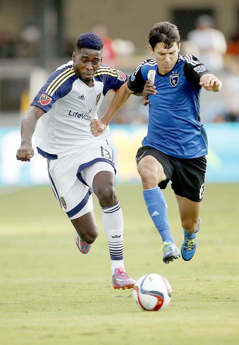 San Jose Earthquakes midfielder Shea Salinas (right) and Real Salt Lake forward Olmes Garcia (13) chase the ball during the second half of an MLS soccer match in San Jose, Calif. on Sunday. San Jose won 1-0.