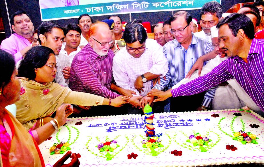 Dhaka South City Corporation Mayor Sayeed Khokon cutting cake in observance of Prime Minister Sheikh Hasina's birthday at Nagar Bhaban of the corporation on Monday.