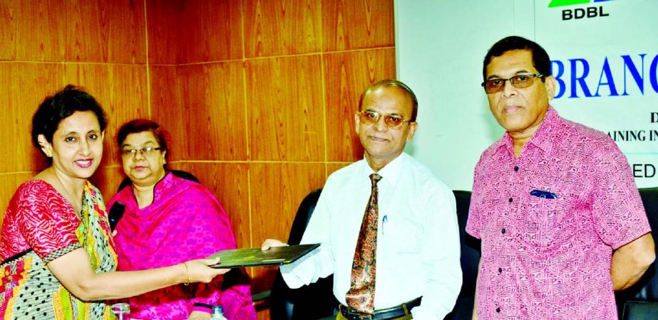 Bangladesh Development Bank Limited (BDBL) recently organized a training course on Branch Management". General Manager of the bank Eng Md Rezaul Karim handing over certificates among participants recently."
