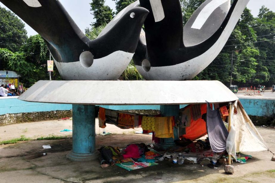 Replicas of doves built for beautification on Dhaka University campus now an abode for floating people. But the authority concerned seemed to be indifferent to free the place from this state.