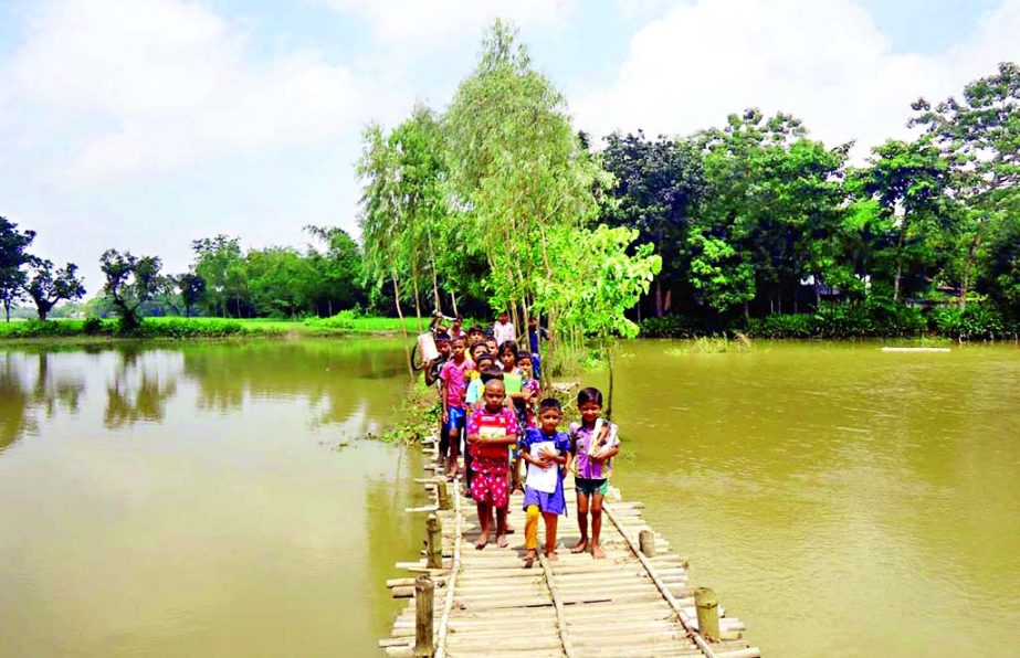 SHERPUR: An iron bridge is urgently needed at Ghagara Dorgarpar village in Jhenigachhi Upazila as this bamboo bridge is the only means of communication for ten thousand people of five villages. This picture was taken on Tuesday.