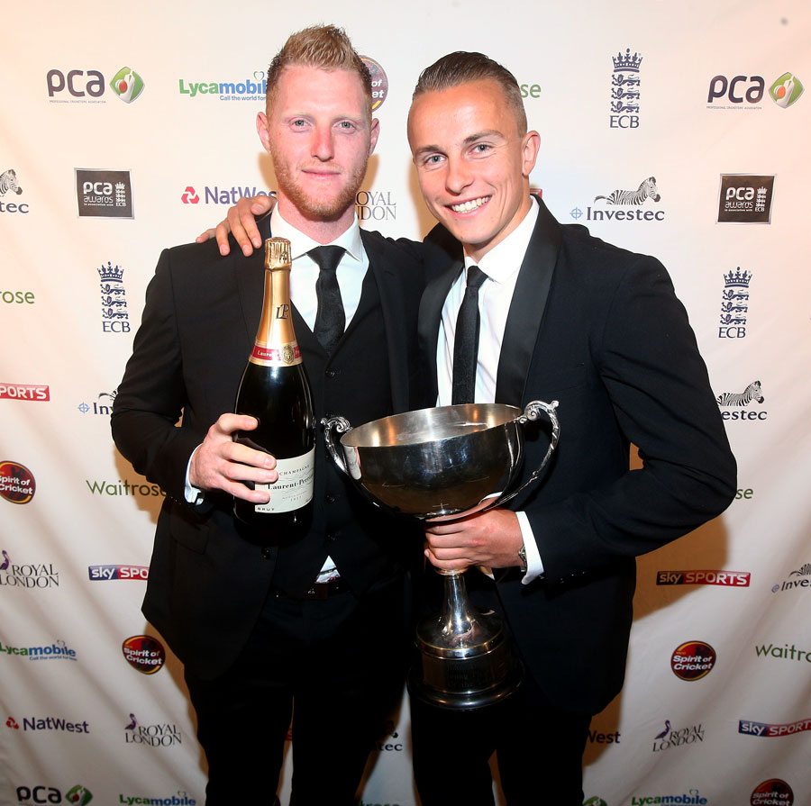 Surrey's Tom Curran (right) after receiving the John Arlott Cup for the PCA Young Player of the Year from Ben Stokes at London on Tuesday.