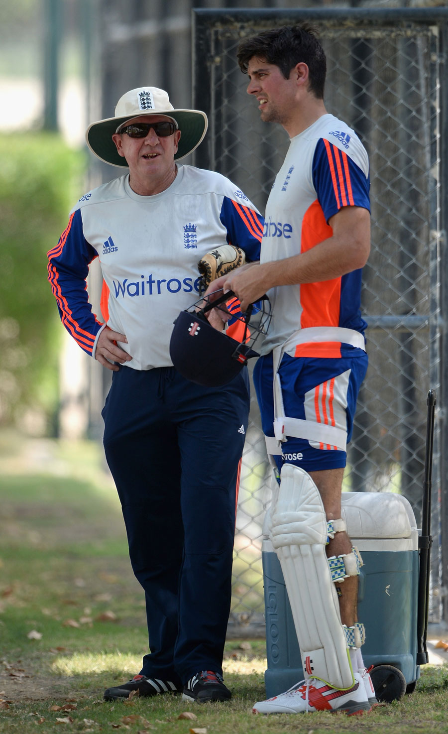 Trevor Bayliss and Alastair Cook have a chat in the shade, Dubai on Saturday.