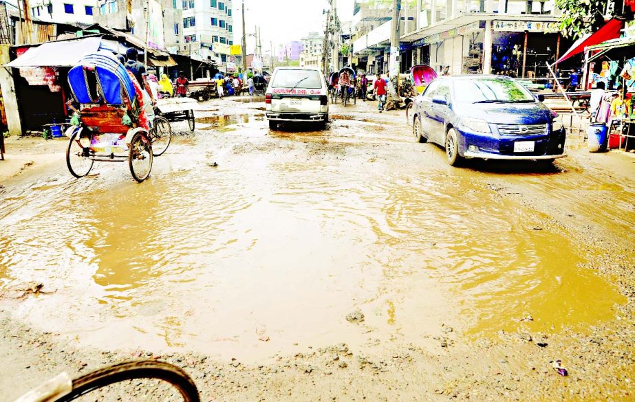 City dwellers and commuters' suffering mount as the main thoroughfare in Postagola area still in dilapidated condition due to water-logging. This photo was taken on Saturday.