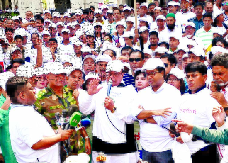 Health Minister Md Nasim speaking at a rally in the city on Sunday for building awareness about Dengue Fever.