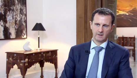 An image grab taken from Iranian state television on October 4, 2015 shows Syrian President Bashar al-Assad speaking during an interview at an unknown location broadcast by Khabar TV, the news channel of the Islamic Republic of Iran Broadcasting