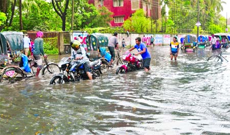 Some parts of city witnessed heavy downpour in short spell of time on Monday inundating roads and footpaths causing sufferings to commuters and city dwellers. This photo was taken from Chandkharpool area.