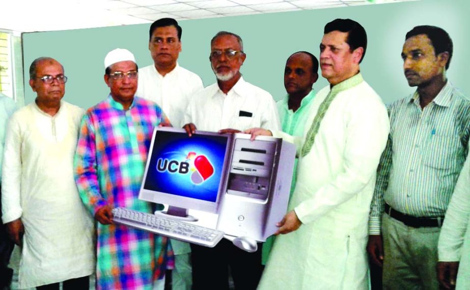 Muhammed Ali, Managing Director of United Commercial Bank Limited, handing over the computers to Hossain Ahmed, Principal of Banshkhali Girls' College at the college auditorium recently. Md Abdul Jabbar Chowdhury, Deputy Managing Director of the bank and