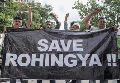 Ethnic Rohingya refugees from Myanmar residing in Malaysia protest outside the Myanmar embassy in Kuala Lumpur demanding an end to the persecution and ill-treatment of the Rohingya community.