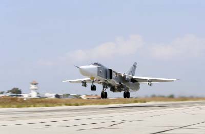 Russian SU-24M jet fighter armed with laser guided bombs takes off from a runaway at Hmeimim airbase in Syria.