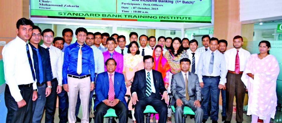 Md Nazmus Salehin, Managing Director of Standard Bank Limited poses with the participants of a 2-day long workshop on "Special Deposit Banking: School Banking and Inclusive Banking" at its Training Institute. Md Zakaria, Principal and Md Amzad Hossain F