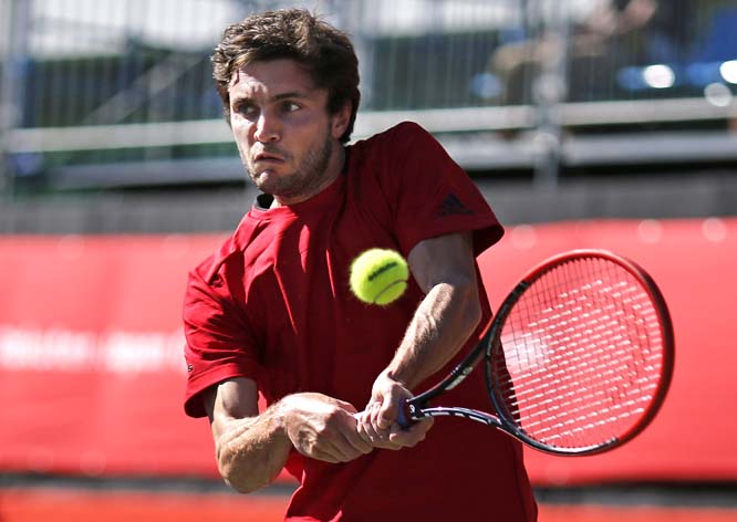 Gilles Simon of France makes a backhand return to Jiri Vesely of the Czech Republic during their singles match at the Japan Open tennis tournament in Tokyo on Wednesday.