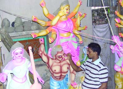 NARSINGDI: Idols makers are busy in working on erection of Puja mandaps and images of the Goddess Durga at the last moment in Narsingdi.