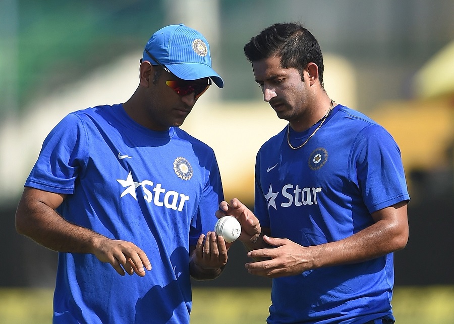 India's captain Mahendra Singh Dhoni (L) advises Mohit Sharma during a training session on the eve of the first one day international (ODI) cricket match between India and South Africa at Green Park Stadium in Kanpur on Saturday.