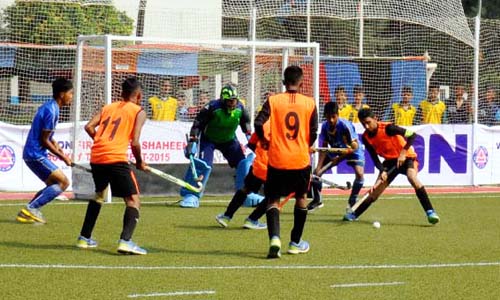 A moment of the match of the Walton 1st Inter-Shaheen College Hockey Tournament at the BAF Shaheen College Dhaka Ground on Sunday.