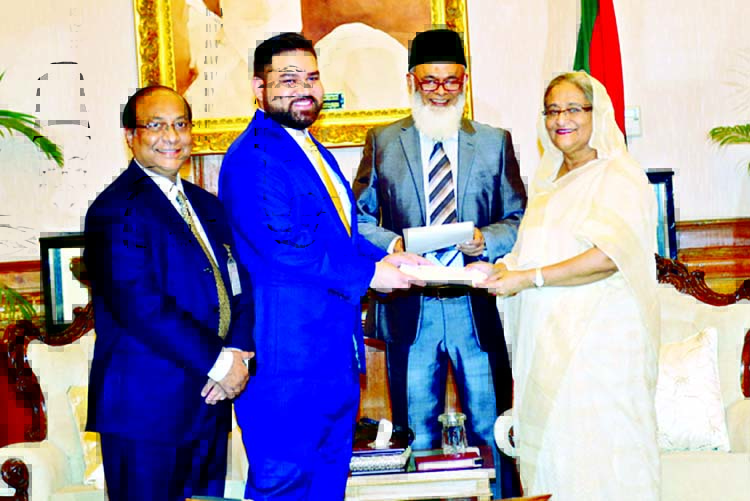Mohammed ImranIqbal, Vice Chairman of Premier Bank Limited handing over a Cheque for Tk50 lakh to Prime Minister Sheikh Hasina as donation for her relief fund on her achievement of receiving awards programs at a function at Gonobhabanon on Monday. Managin