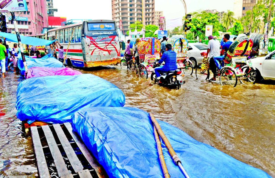 City's business hub Motijheel Commercial Area was inundated by rain water during a short spell of downpour. This photo was taken on Tuesday.