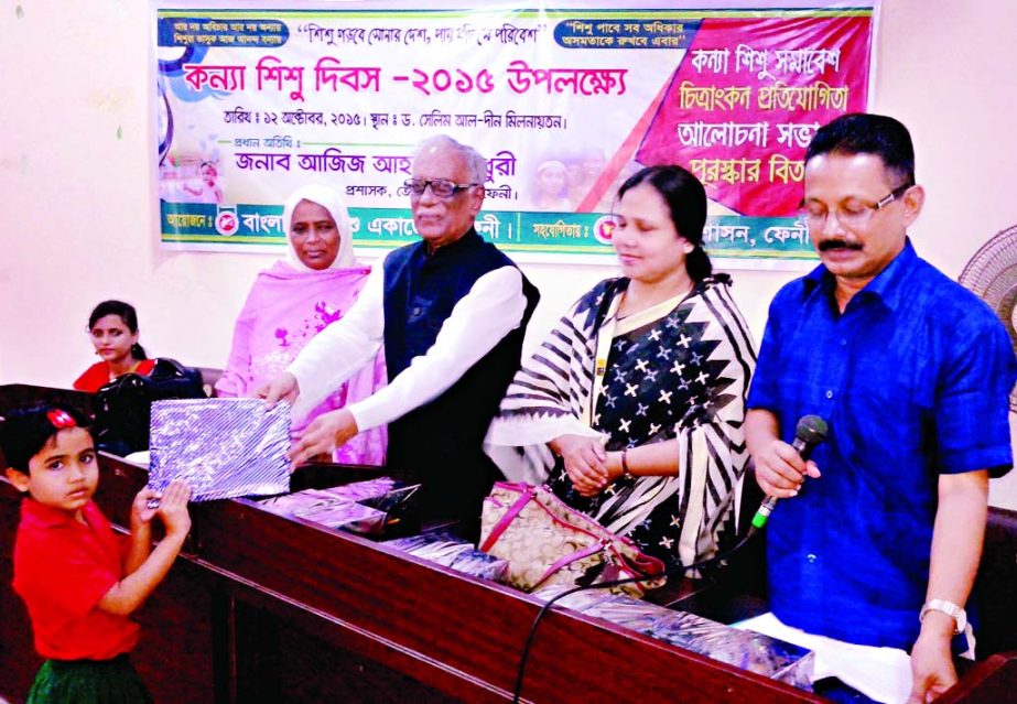 FENI: Aziz Ahmed Chowdhury, Administrator, Feni Zila Parishad distributing prizes among the winners of art competition marking the International Girl Child Day organised by Bangladesh Shishu Academy, Feni on Monday.