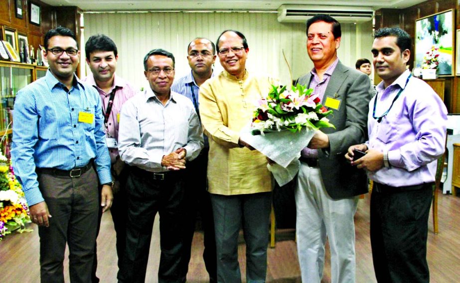 Muhammed Ali, Managing Director of United Commercial Bank Limited, felicitating Dr Atiur Rahman, Governor, Bangladesh Bank for winning the 'Central Bank Governor of the Year for Asia 2015' award from UK based financial newspaper 'The Emerging Markets