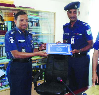 SYLHET: Md Mizanur Rahman PPM, DIG, Sylhet Division giving crest to Officer-In- Charge of Srimongol Thana Md Mahabubur Rahman as best police officer in the division on Monday.