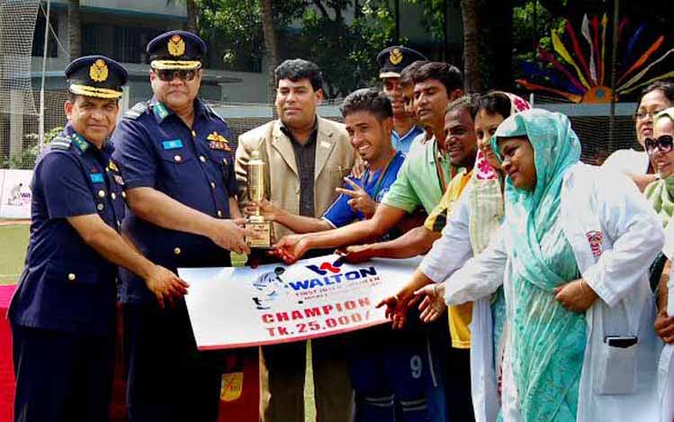 Chief of Air Staff Air Marshal Abu Esrar giving away the champions trophy to BAF Shaheen College Dhaka team, which won the title of the Walton 1st Inter-Shaheen College Hockey Tournament at the Hockey Turf of BAF Shaheen College Dhaka on Thursday.