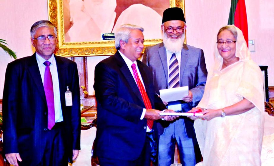 Azam J Chowdhury, Chairman Prime Bank, handing over a cheque to Prime Minister Sheikh Hasina for her "Relief Fund" at the Gonobhavan recently. Managing Director of the bank Ahmed Kamal Khan Chowdhury was present.
