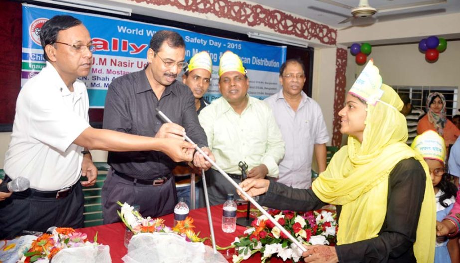 CCC Mayor Alhaj AJM Nasir Uddin distributing white sticks among the disabled people at a function organised by the Sight Disabled Welfare Society on the occasion of World White Stick Security Day yesterday.