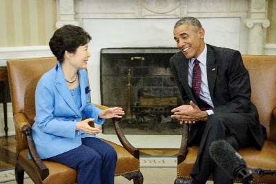 US President Barack Obama and South Korean President Park Geun-hye talk before a meeting in the Oval Office of the White House on Friday.