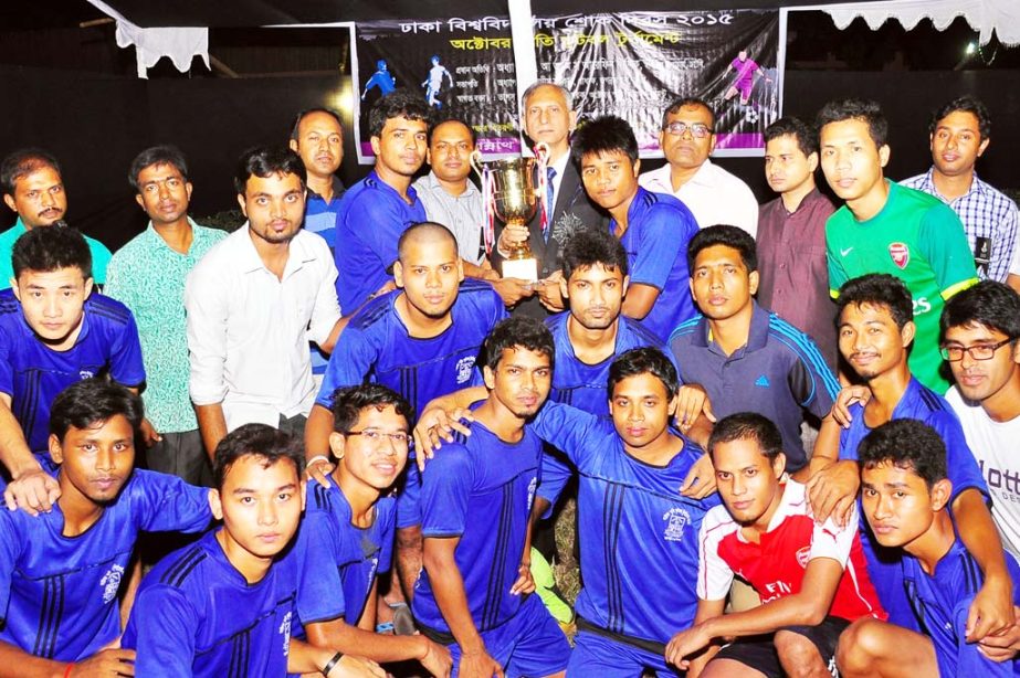 Members of Sontoshchandra Bhattachriya Bhaban of Jagannath Hall of Dhaka University, the champions of the October Memorial Football Tournament with the guests and officials of Dhaka University (DU) pose for a photo session at the Play Ground of Jagannath