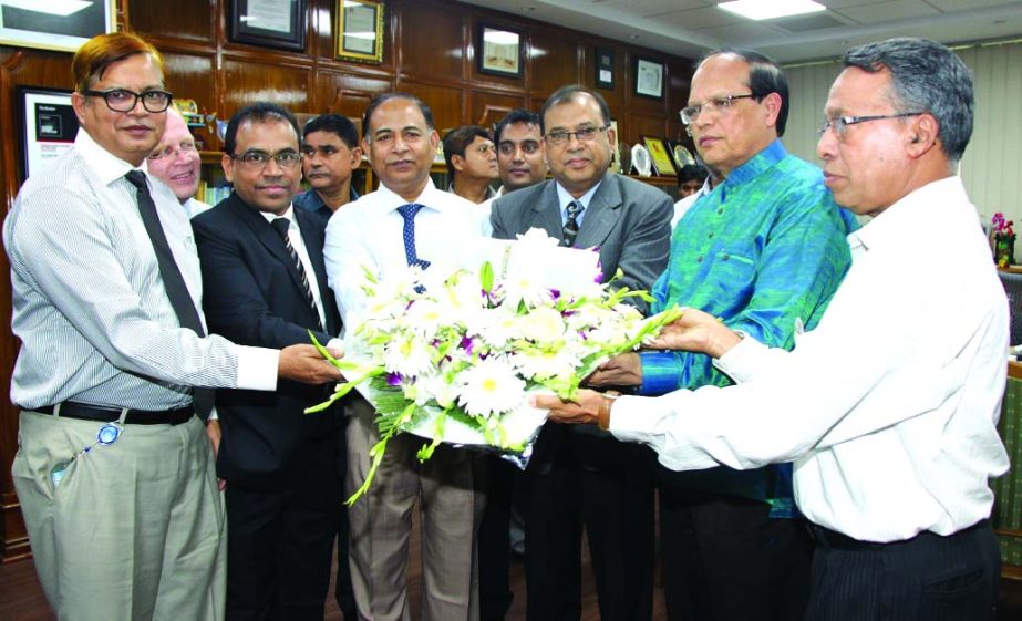 Md Abdus Salam, FCA, Managing Director of Janata Bank Limited, congratulating Bangladesh Bank Governor Dr Atiur Rahman for achieving the award of Central Bank Governor for Asia 2015 at the latter's office on Sunday.