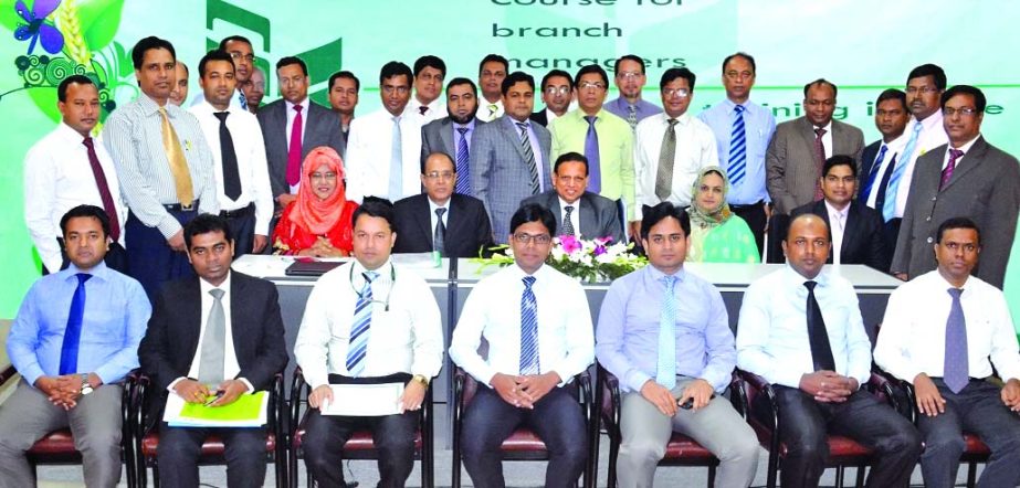 Abdul Hamid Mia, Additional Managing Director of National Bank Limited, poses with the participants of a 5 days training course on "Refreshers Course for Branch Managers" recently. Hari Narayan Das Principal (cc) and Farzana Haque Sr Faculty Member of t