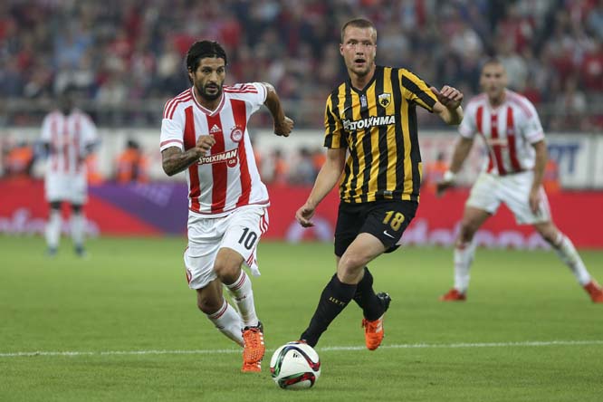 Olympiakosâ€™ Alejandro Damian Dominguez from Argentina (left) tries to control the ball against AEK Athensâ€™ Jakob Johansson from Sweden during their Greek Super League soccer match at the Georgios Karaiskakis Stadium in Piraeus port, near Ath